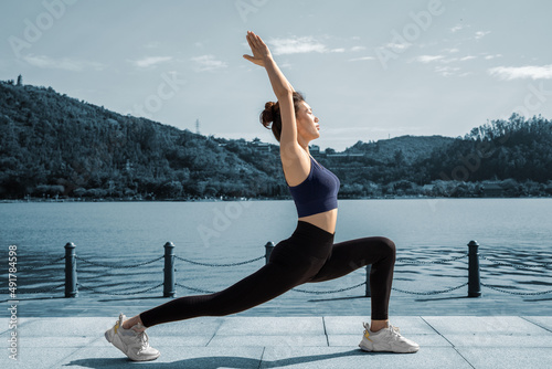 Slim girls do yoga exercises outdoors