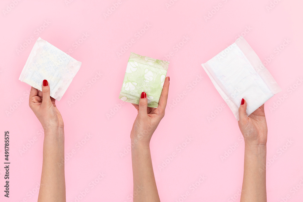 woman holding sanitary napkin woman holding sanitary napkin