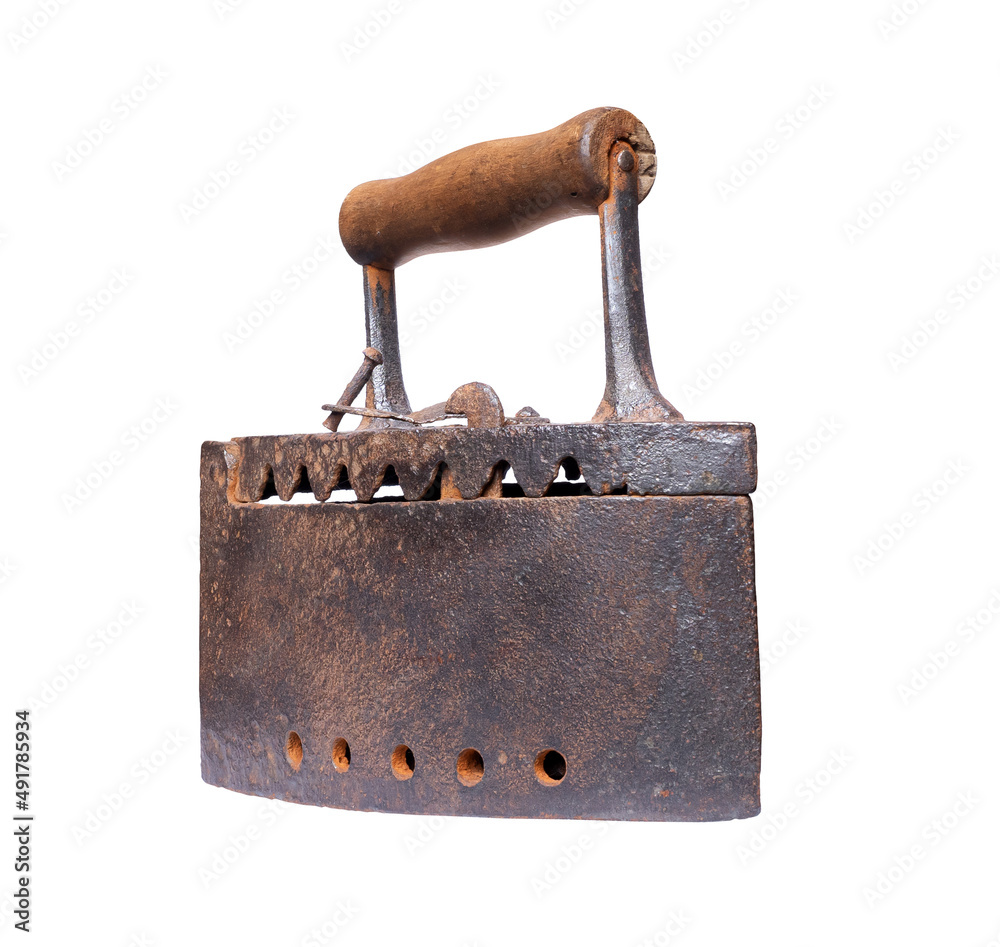 The old rusty coal iron close up isolated on a white background The old rusty coal iron close up isolated on a white background