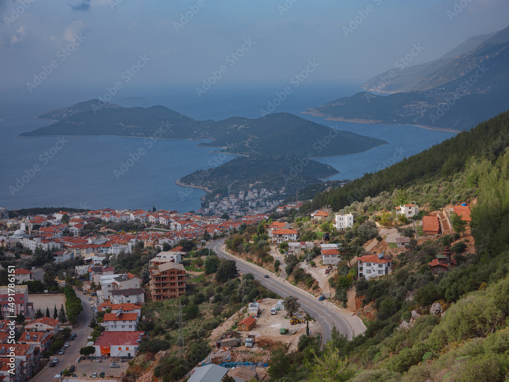 Harbour of city Kas or Kash in Turkey and Greek island Kastelorizo. Charming view of seaside resort town. Romantic harbour with yacht marina and mosque with minarets Harbour of city Kas or Kash in Turkey and Greek island Kastelorizo. Charming view of seaside resort town. Romantic harbour with yacht marina and mosque with minarets