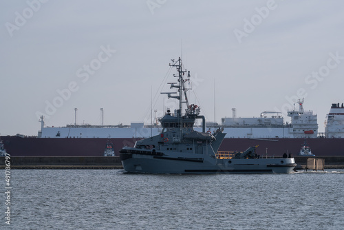 TUGBOAT AND LNG TANKER - A ship of the Polish Navy goes to sea