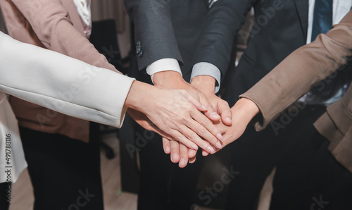 Wallpaper Mural Business team showing unity with their hands together to star up corporation in teamwork project in business successful team concept Torontodigital.ca