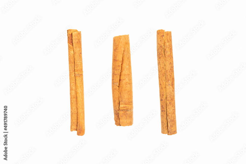 stick of cinnamon on a white background stick of cinnamon on a white background