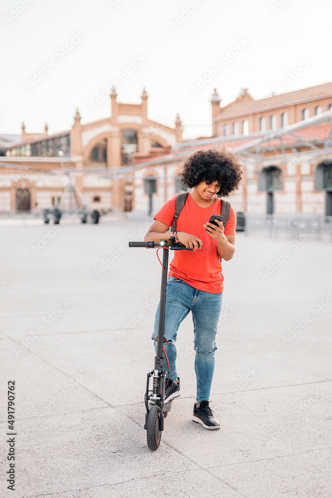 Afro American Boy Looking at Phone