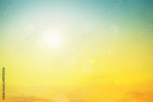 Relaxing outdoors vacation landscape concept: Abstract blurred sunlight beach colorful blurred bokeh background with retro effect autumn sunset sky have blue bright, white, and color orange calm.