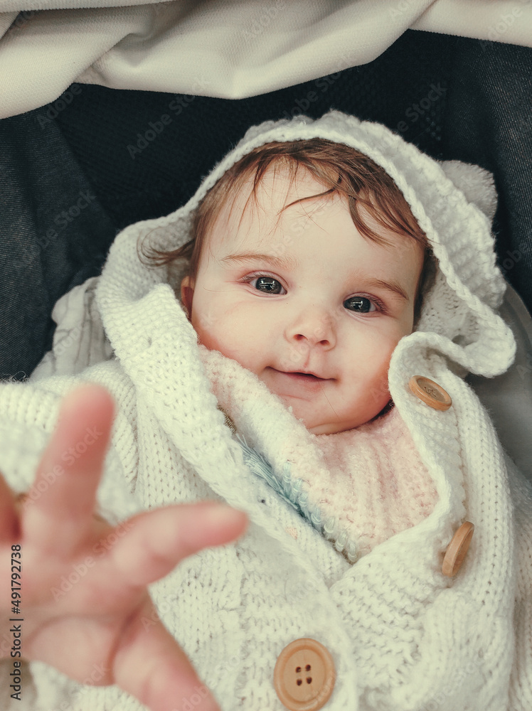 Lovely little girl wearing a bear woolen coat Lovely little girl wearing a bear woolen coat