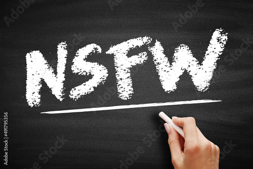 NSFW Not Safe For Work - Internet slang used to mark links to content the viewer may not wish to be seen looking at in a public, acronym text on blackboard photo