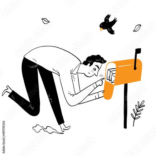 Young man opening a mailbox