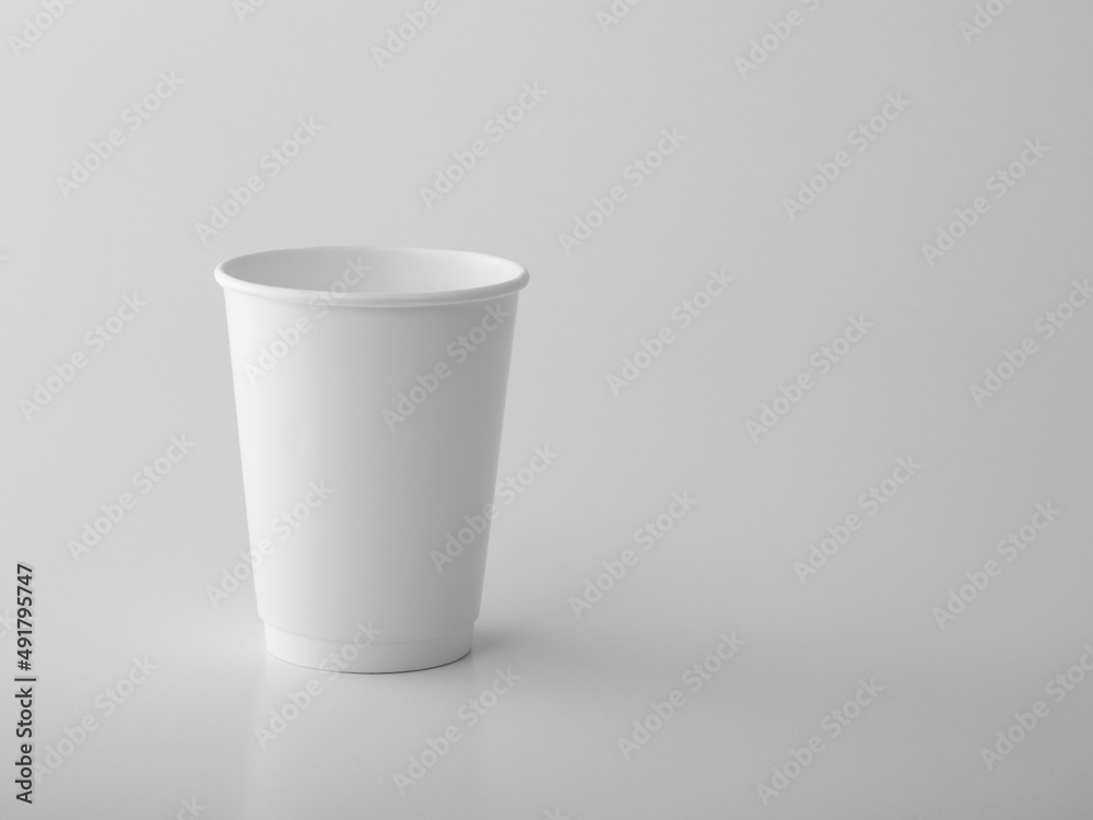 White takeaway paper cup on white background. White takeaway paper cup on white background.