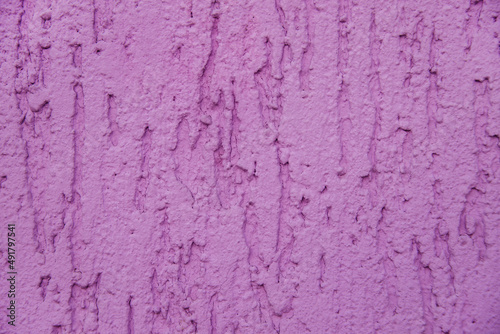 Background surface with the texture of pink plaster. Old cement horizontal wall.