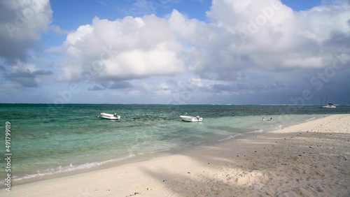 MAURITIUS - MAY 2019: People enjoy Pointe D'Esny public beach. This is a famous beach in Mauritius photo