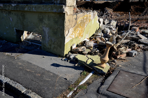 demolition of an apartment building worker on a forklift using a jackhammer. creates an apocalyptic scene. clearing work after the bombing. reconstruction of the historic castle building