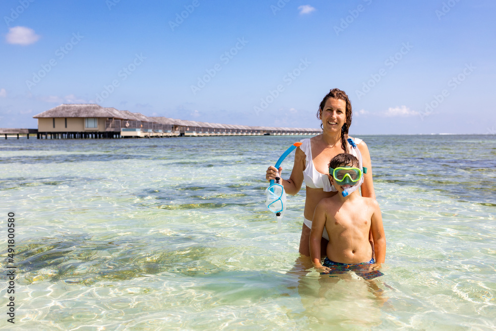 Mother and son snorkeling on the Maldive Islands
