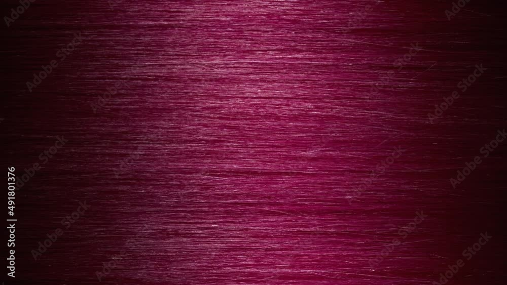 Hair texture | Vertical shot of A wave passes through pink hair | Vibrant hair coloring concept Hair texture | Vertical shot of A wave passes through pink hair | Vibrant hair coloring concept