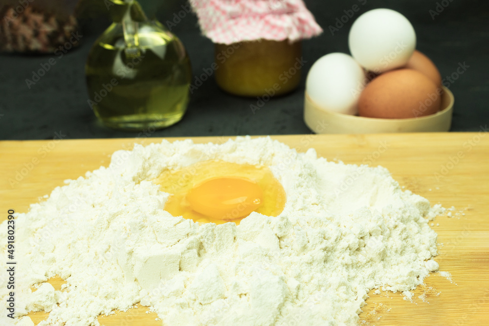 Fresh and raw chicken egg in flour Fresh and raw chicken egg in flour