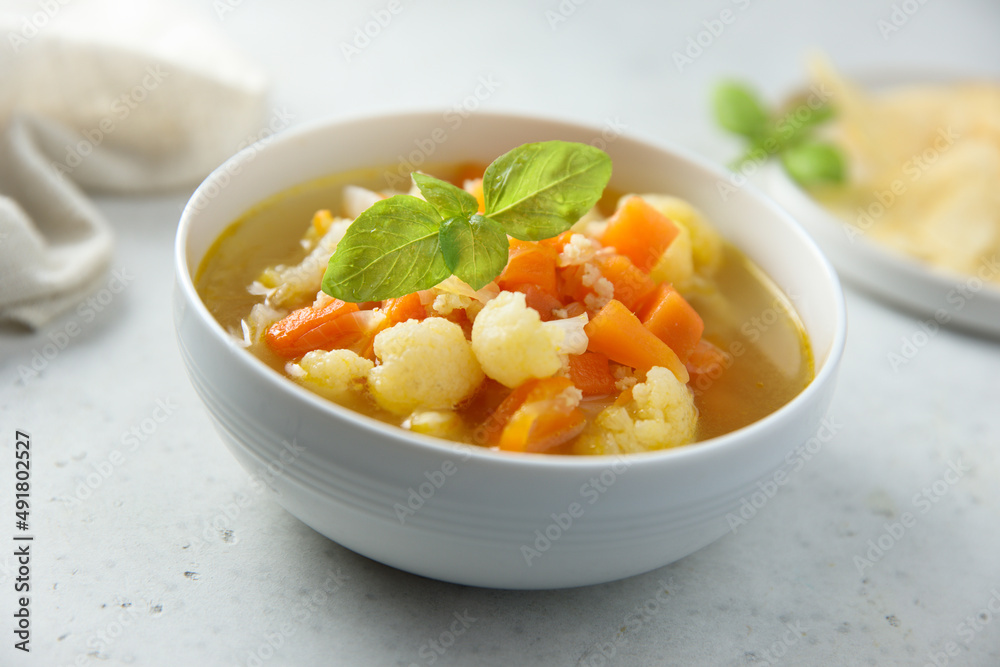 Homemade cauliflower soup with fresh basil Homemade cauliflower soup with fresh basil