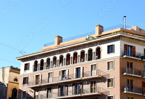 Facade of a building. Residential building with balconies. Colorful buildings and hotel apartments. Facade of residential building in Spain. House with window and balcony. Buildings architecture 