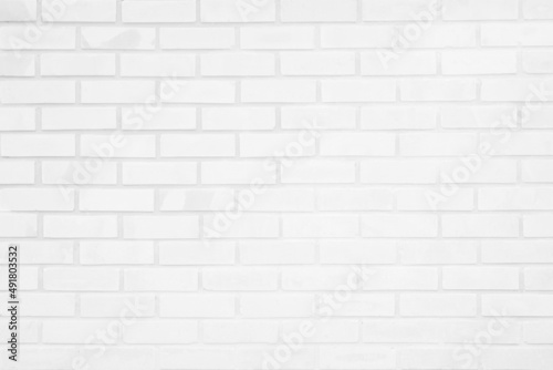 White grunge brick wall texture background for stone tile block painted in grey light color wallpaper interior room decorative.