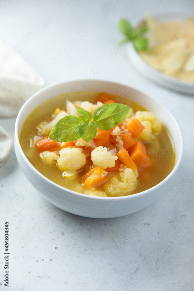 Homemade cauliflower soup with fresh basil Homemade cauliflower soup with fresh basil
