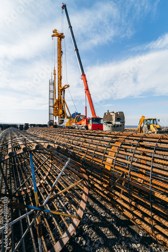 Canvas Print The beginning of the construction of a concrete bridge in the field