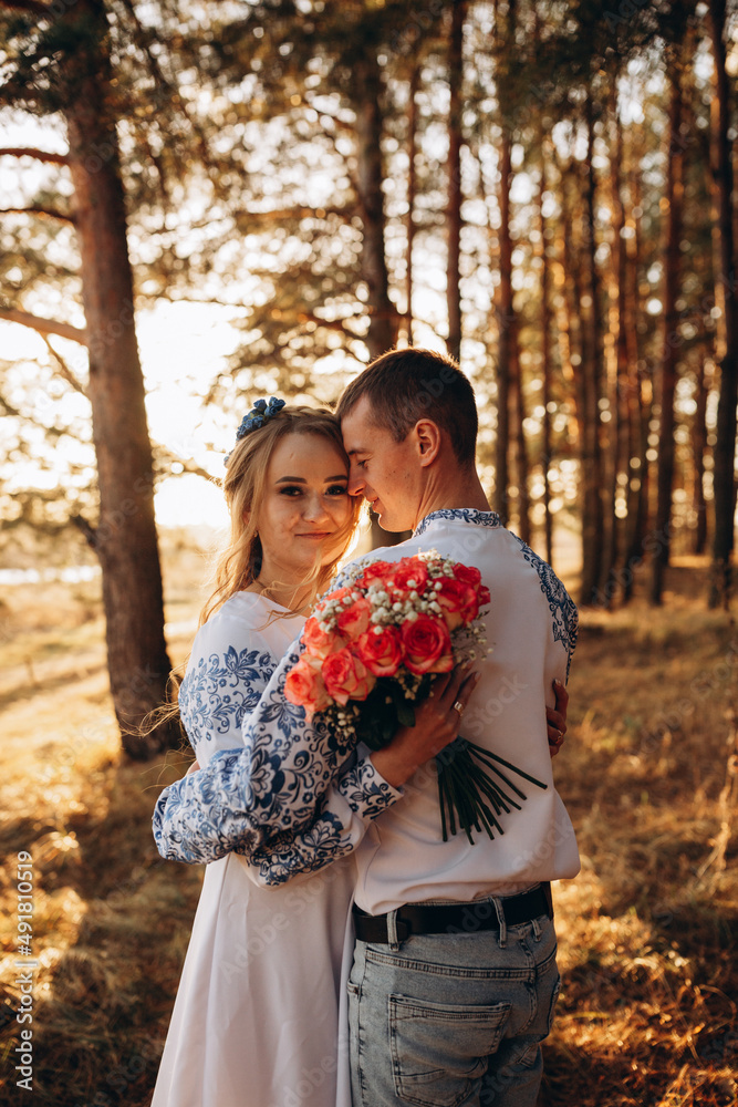 Bride and groom in Ukrainian national clothes. Wedding embroidered clothes. Wedding in the Ukrainian style. Happy bride in traditional Ukrainian embroidered dress. Ukrainian patriots Bride and groom in Ukrainian national clothes. Wedding embroidered clothes. Wedding in the Ukrainian style. Happy bride in traditional Ukrainian embroidered dress. Ukrainian patriots