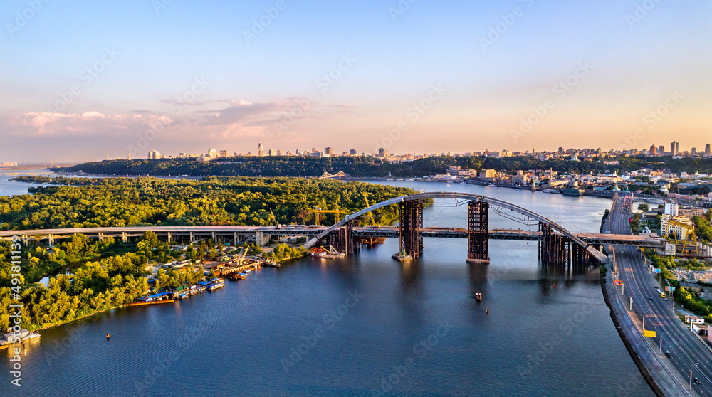 Aerial view of the Dnieper river with unfinished bridge in Kyiv, Ukraine, before the war with Russia