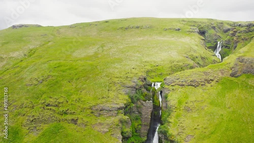 Beautiful Mountainside Cascading Waterfall Gluggafoss In Southern Iceland. 4K Drone. photo