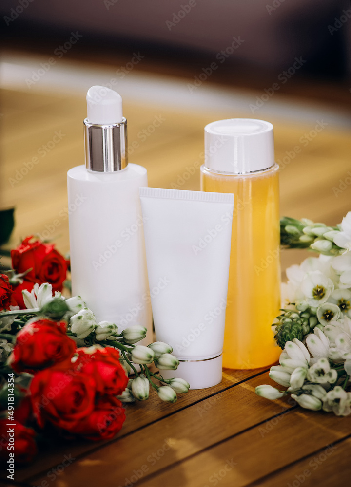 mockup of beauty fashion cosmetic makeup bottle serum dropper product with skincare with flowers .healthcare concept