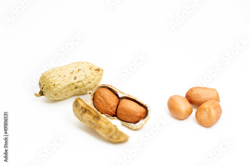 peeled peanuts isolated on white background. Top view.