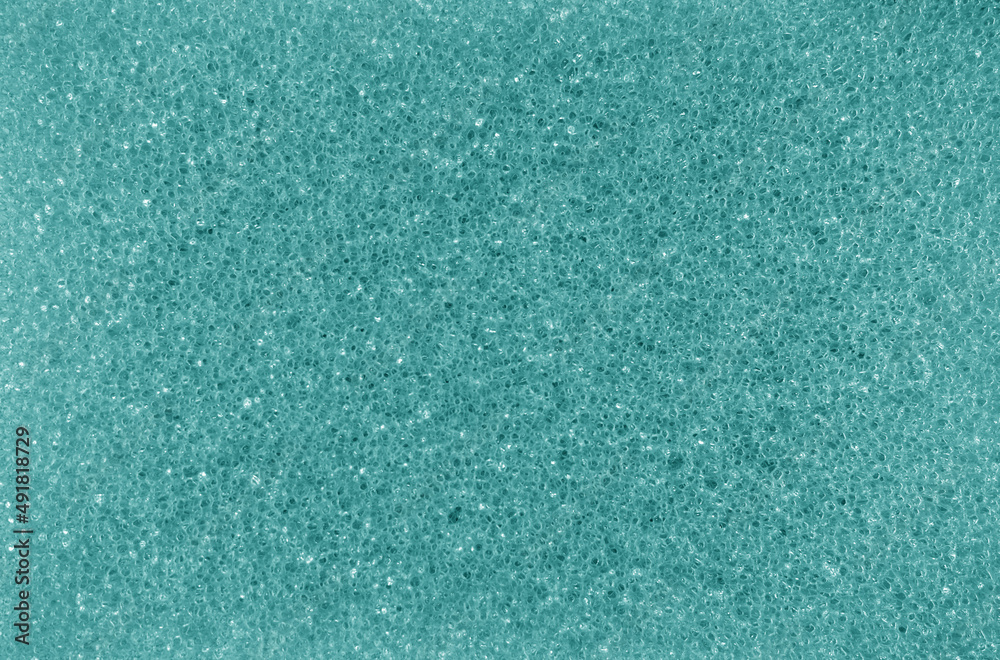 Cleaning sponge texture in cyan tone. Cleaning sponge texture in cyan tone.