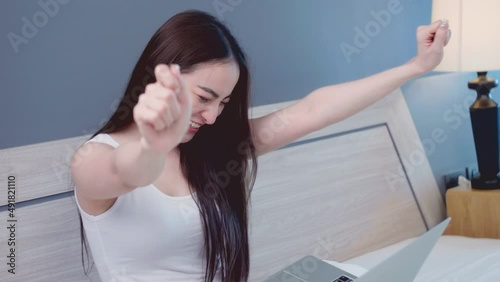 Young Asian happy woman using laptop while success and finish job deal at home. Asian young lesbian Lgbt relationship and travel concept for stock footage.