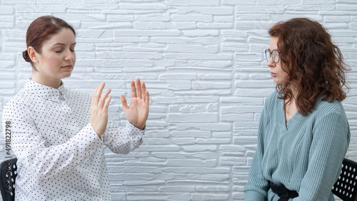 The psychotherapist conducts a hypnosis session. Female patient under hypnosis.