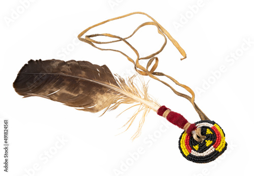 Eagle feather beaded as Indian hair accessory isolated on white