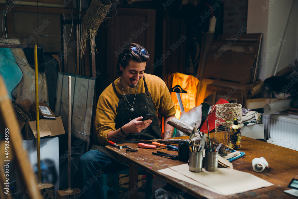 man working in his workshop man working in his workshop