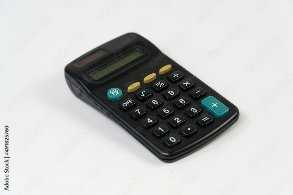 Mini electronic calculator top view, finance and banking calculation isolated on white background, hand size calculator with solar energy panel, slanted object Mini electronic calculator top view, finance and banking calculation isolated on white background, hand size calculator with solar energy panel, slanted object