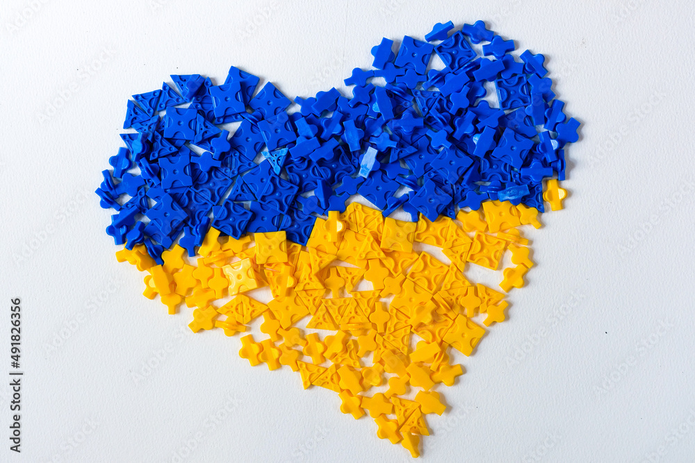 Fototapeta premium blue and yellow heart on white background