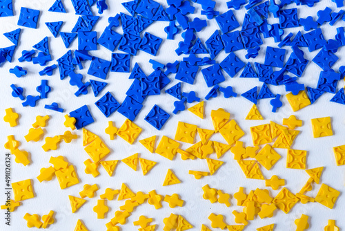 blue and yellow jigsaws on white background