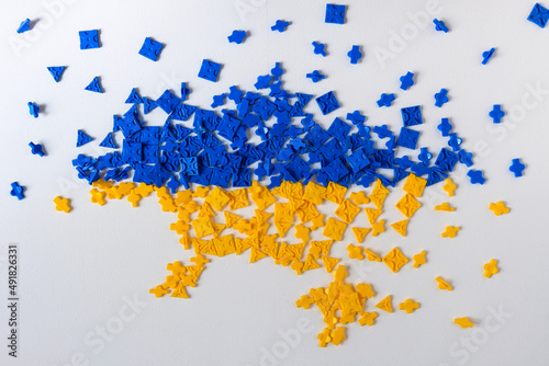 blue and yellow jigsaw forming Ukraine on white background