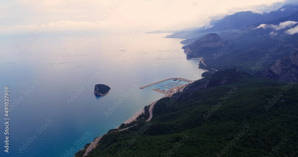 Aerial high angle shot of the Barinaklar harbour and Sican Island panoramic view from Tunektepe Antalya Aerial high angle shot of the Barinaklar harbour and Sican Island panoramic view from Tunektepe Antalya