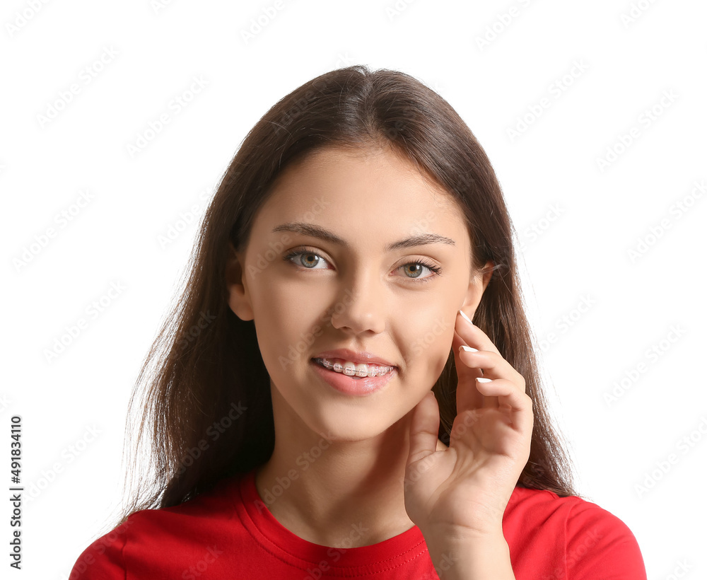 Pretty teenage girl with dental braces on white background Pretty teenage girl with dental braces on white background