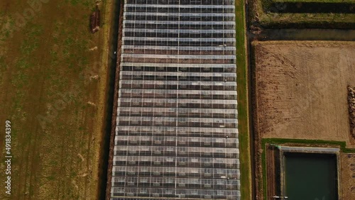 Aerial View Of Industrial Agricultural Greenhouses In Barendrecht. Birds Eye View Pedestal Down Dolly photo