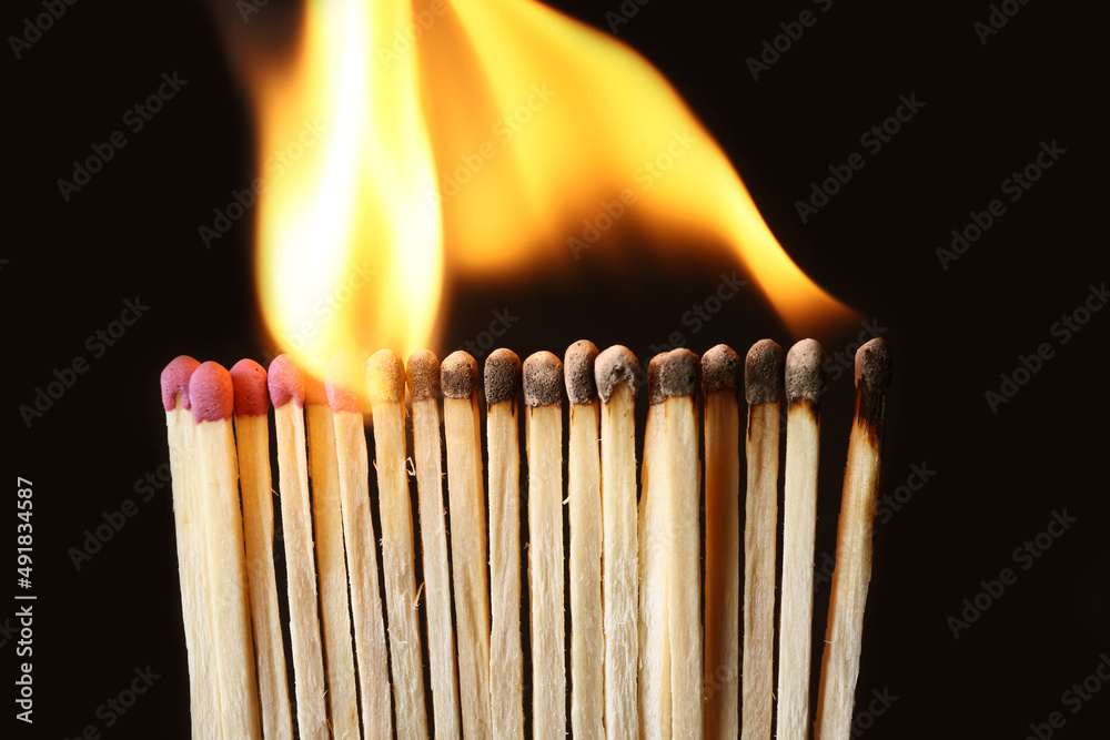 Line of burning matches on black background, closeup. Inspiration concept Line of burning matches on black background, closeup. Inspiration concept
