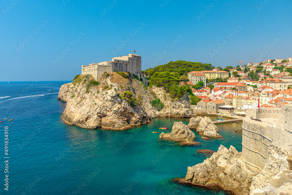Aerial view on Dubrovnik city walls of Croatia. View of Fort Lovrijenac fortress, and the West Harbour. Dubrovnik UNESCO World Heritage Site is an old Venetian city of Croatia in Dalmatia