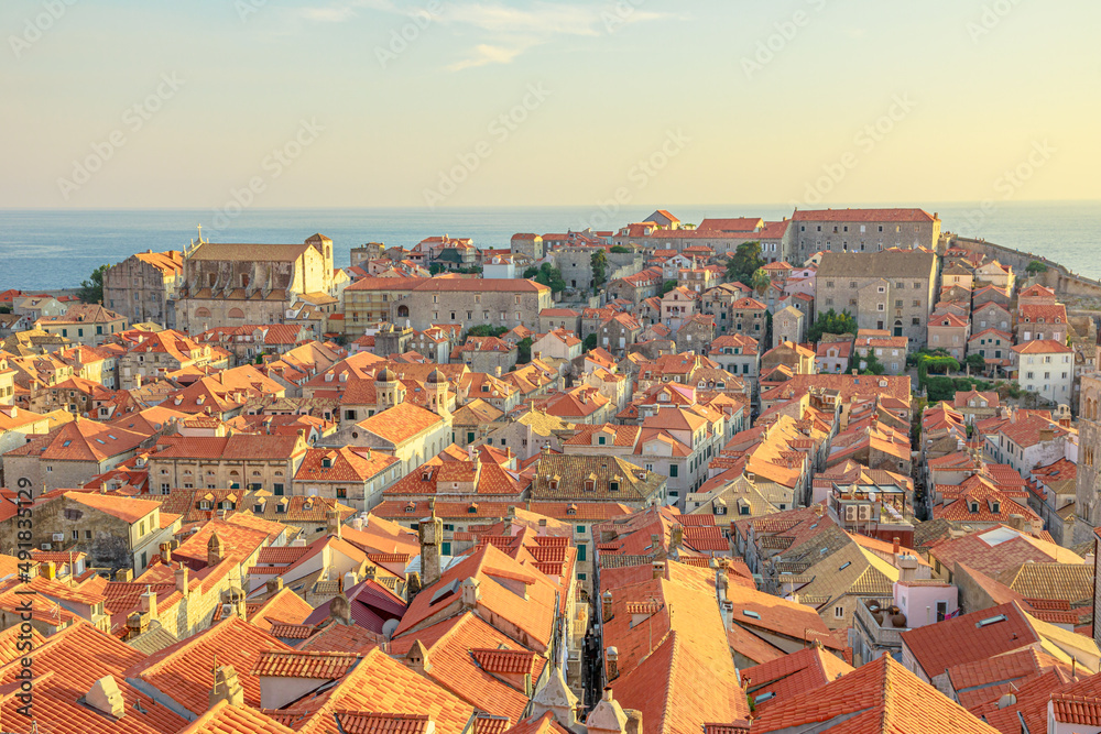 Aerial view on Dubrovnik walls at sunset in Croatia. View of Fort Lovrijenac fortress and church Crkva sv. Vlaho Saint Biagio of Dubrovnik UNESCO Venetian town of Croatia in Dalmatia Aerial view on Dubrovnik walls at sunset in Croatia. View of Fort Lovrijenac fortress and church Crkva sv. Vlaho Saint Biagio of Dubrovnik UNESCO Venetian town of Croatia in Dalmatia