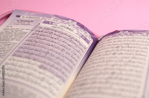Muslim Al-Quran with Indonesian translation on pink background