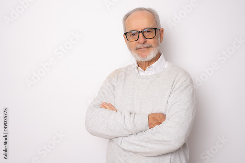 Happy cheerful man in casual clothing with arm crossed rejoicing at his retirement. Health, beauty concept.
