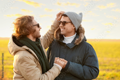 Happy gay couple in autumn ...