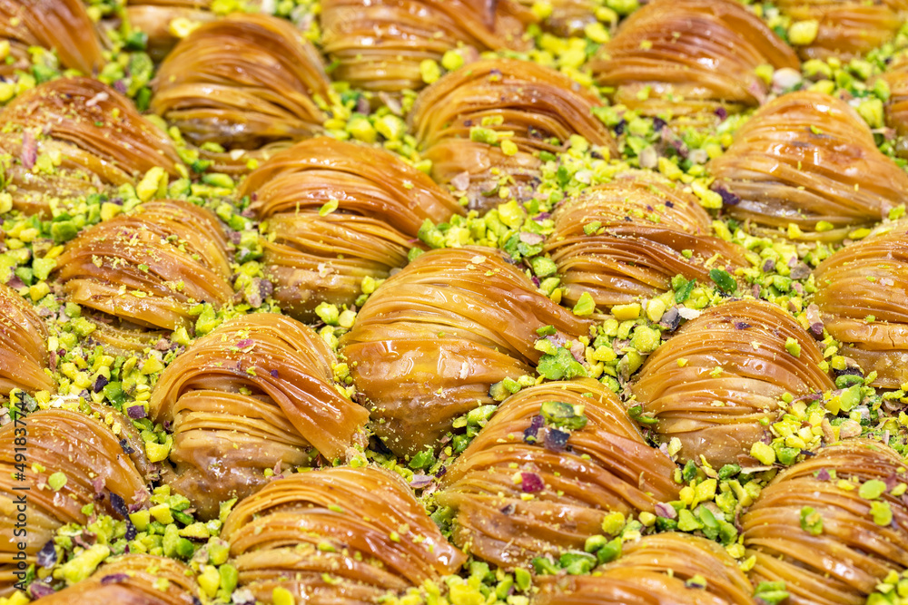 Mussel Baklava with Pistachio. Close-up. Traditional Middle Eastern Flavors. Traditional Turkish baklava. local name midye baklava