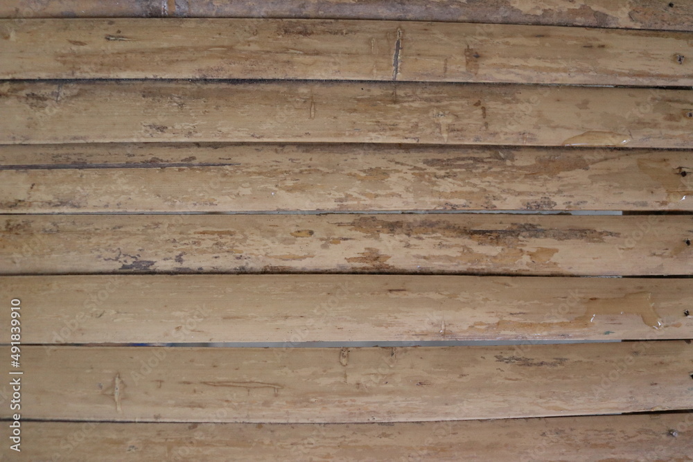Fototapeta premium Old light brown and dirty bamboo row background.