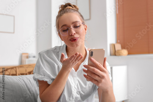 Pretty young woman using mo...